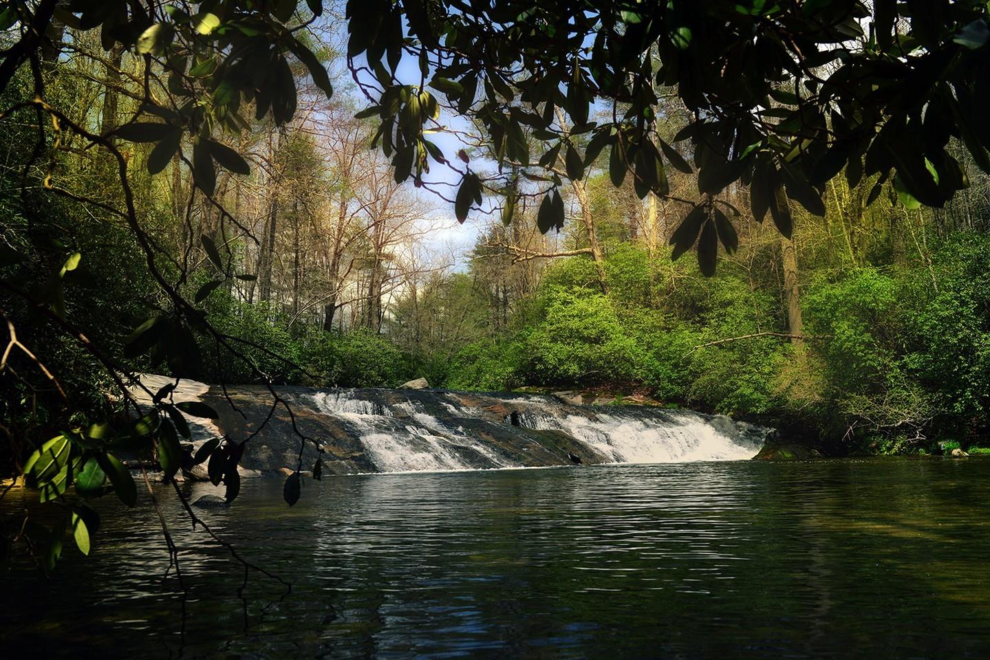 Enjoy the last few weeks of summer by cooling off in mountain waters. Take a short hike to Little Sliding Rock, less than a thirty-minute drive from Highlands. To get there, head down 64 East from Highlands to Cashiers. When you reach the crossroads in Cashiers, head south on 107 to Whiteside Cove Road for 2.6 miles where the road crosses the Chattooga River. Pull over once you cross the bridge. Have you hiked to Little Sliding Rock?