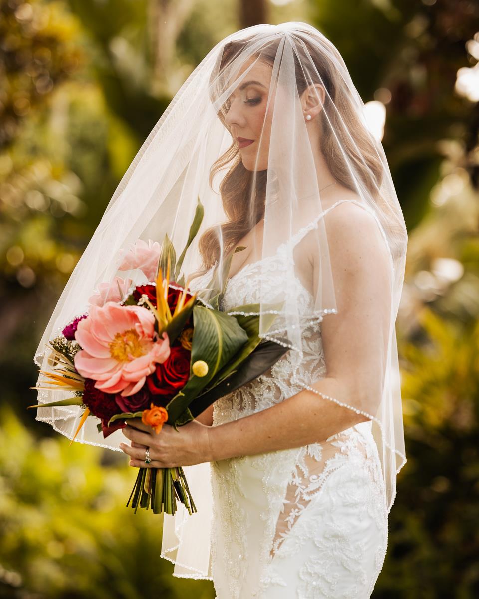 Couples planning your wedding: If you have a long veil or one that has a lot of beading or lace, make sure you have bobby pins to secure the hair comb so that it doesn't fall out from the weight or wind or someone accidentally snagging it. There are multiple different lengths and colors of veils to, make sure to try it on with the dress to see how it all looks together.

Styled Wedding Vendors: 
Venue: Victoria 1883 victoriaestate1883
Planner: Simply Enchanted Events simplyenchantedeventsfl
Photography team: Koontz Photography KoontzPhotography assisted by Jenn Ross Photography JennRossPhotography
HUMA: Laura Reynolds Artistry laurareynoldsartist
Flowers: Impekable Flowers impekableflowers
Dresses: Theory Bridal House theorybridalhouse
Suit: Leonardo Fifth Avenue leonardofifthavenue
Video: Densmore Films densmore_films
Stationary: Rosebud Calligraphy rosebudcalligraphy
DJ: iRock Your Party irockyourparty
Rentals: Premier Event Rentals premiereventsorlando
Linens: Connie Duglin Linens cdlinen
Models: Katherine & Corey

#StyledShoot #StyledWedding #TropicalHollywoodGlam #TropicalWeddingInspo #TropicalHollywoodWedding #HollywoodGlam #HollywoodGlamWedding #WeddingInspo #FloridaWeddingVenue #WeddinginNSB #NSBWedding #NewSmyrnaBeachWedding