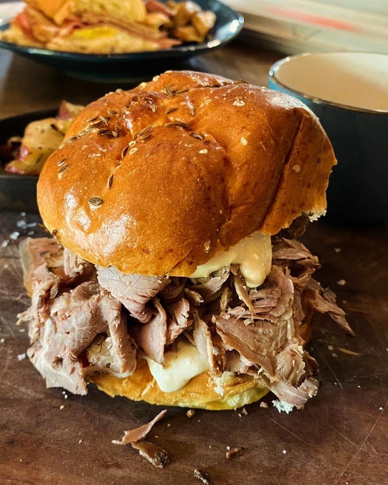 Our roast beef sandwich 😋 Thinly sliced, herb-basted top round piled high on a soft kümmel weck roll. Simple, savory, and exactly what you’ve been craving.