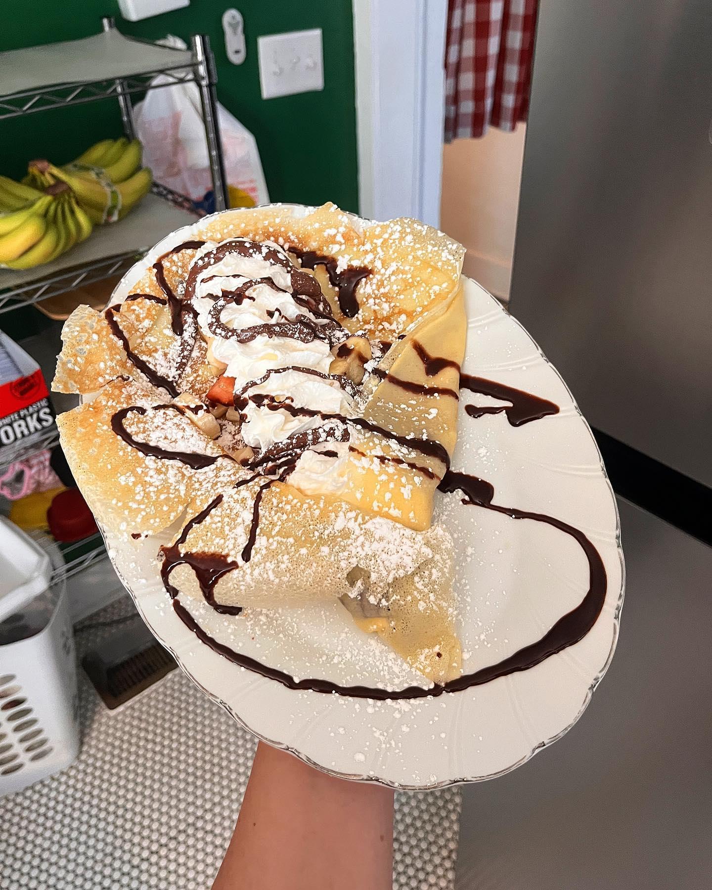 The Love of my Life Crêpe: Nutella spread, strawberries, bananas, whipped cream, drizzled with chocolate syrup and dusted with powdered sugar. What a fitting name! 😍