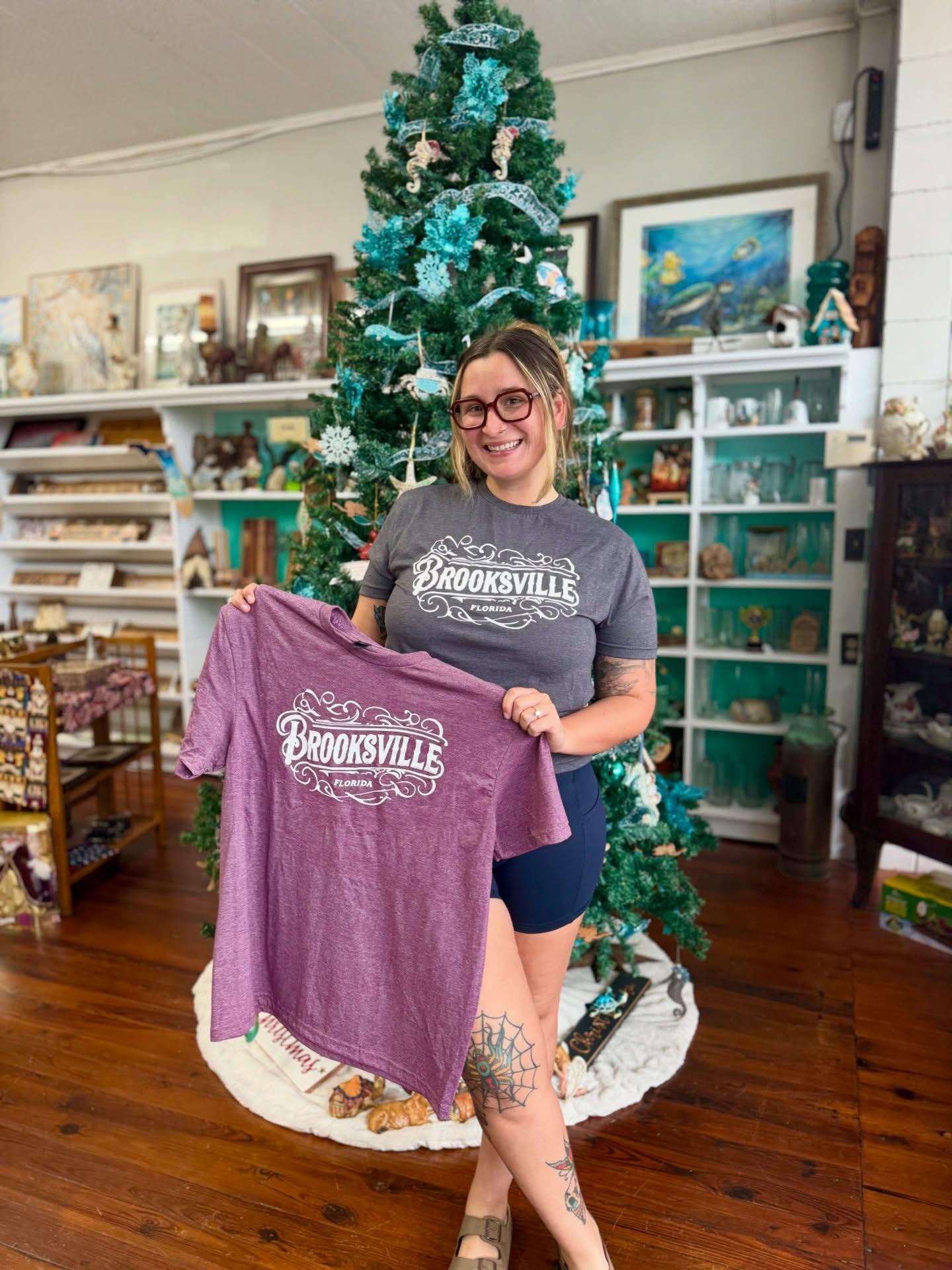 We're so excited to share that we've got new merch in time just for the holidays! Now on sale are our Brooksville T-shirts & Home of the Tangerine tote bags. 🧡🍊

Get yours for your fellow Brooksvillians only at 5 N Main St. inside of brooksvilleuniqueboutique. We've got two shirt colors to choose from and tote bags with room for stocking stuffers or local goodies to keep for yourself or share with your loved ones! 

Come on by to grab this collab merch and check out our other clothing and local vendors and makers while you visit. And don't forget to support all of the amazing small businesses around our store when you do stop in. Let's it local and spread the love. Happy holidays, Brooksville! 

#brooksvillefl #fladventurecoast