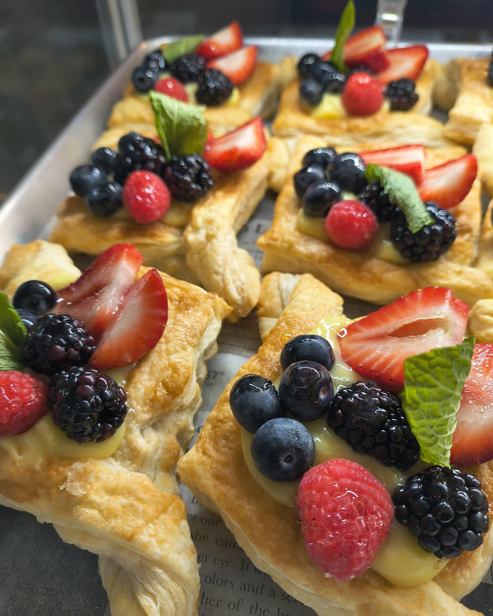 Blessed Saturday!! Come and get a delicious treat for the weekend. Today our empanada flavors are chicken with cheese and beef with sweet plantain.  We are open from 9am to 5 pm Saturdays. See you soon. Some of the pastries pictures are tiramisu donuts, cream cheese Danish, chocolate Cruffins, fruit tarts, blue berry Scones.