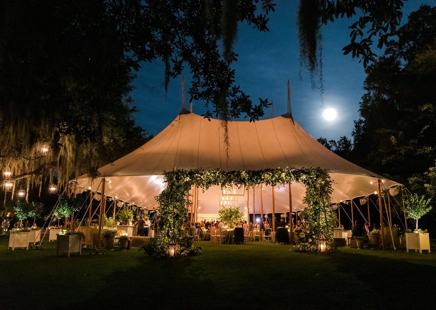 Over the (full) moon about this wedding, too? Head to our friends overthemoon (link in bio) to see more! Fun Fact: Clay and Grover's wedding day fell during the May Full Flower Moon 🌸⁠ 🌚 named for all of the flowers that are bursting into bloom during the month of May.⁠
⁠
Photo gaylebrooker ⁠
Tent skylinetentcompany ⁠
Florals sygdesigns⁠
Lighting technicalevent⁠
kcdmaxwell groveriv